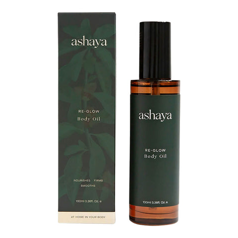 100ml bottle of ashaya Re-Glow Body Oil next to its box, a formula designed to support the skin during the perimenopausal years. This healing botanical oil blend is infused with precious ingredients to help firm, nourish, and deeply hydrate the skin. Gently scented to soothe you throughout perimenopause. Suitable for all skin types.