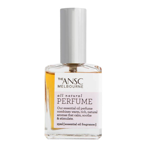 A glass bottle of natural perfume with a romantic and floral scent.