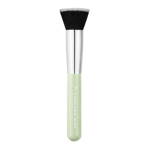 Avocado Zinc SPF Brush, a kabuki style brush with synthetic vegan fibres specifically designed for applying SPF products to the face to achieve a quick and easy, flawless finish. The handle is light green with Avocado Zinc's logo and name embossed in silver, and the bristles are black with white ends.