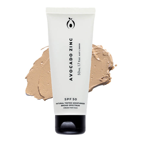 50ml Avocado Zinc SPF50 Natural Tinted Moisturiser in the Medium-Dark shade, suitable for olive and extra tanned skin. This 100% natural, vegan formula provides coverage, evens skin tone, conceals blemishes, and blends well across all skin tones. Features moisturising properties and SPF50 broad spectrum protection. Vegan and cruelty free. Packaged in a white tube with minimal black text.