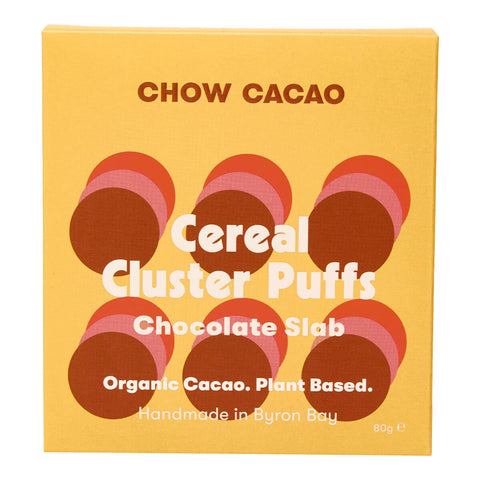 80g box of Chow Cacao Chocolate Slab in Cereal Clister Puffs flavour, a vegan caramel chocolate with crispy chocolate cereal puffs. Made with organic ingredients. Packaged in simple yellow, brown, and pink packaging.