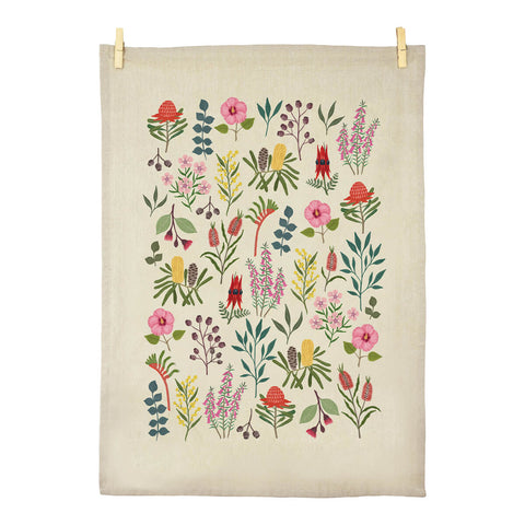 Tea towel made of certified organic cotton featuring illustrations of botanicals by Negin Maddock.