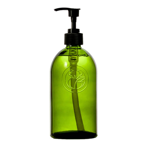 Green apothecary glass bottle with a pump dispenser.