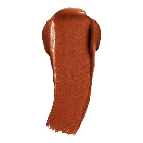 Swatch of cream foundation in the shade 'Damask', a deep shade with warm undertones.