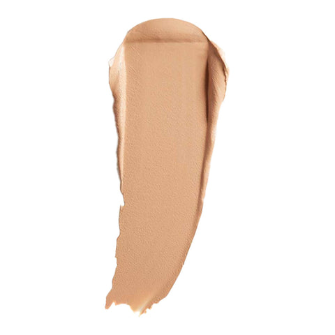 Swatch of cream foundation in the shade 'Silk', a medium shade with neutral undertones.