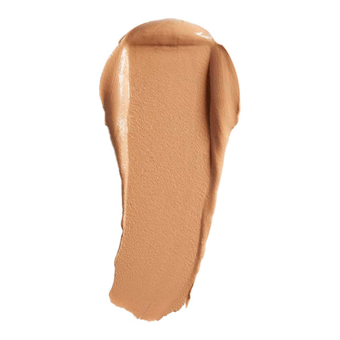 Swatch of cream foundation in the shade 'Suede', a tan shade with warm undertones.