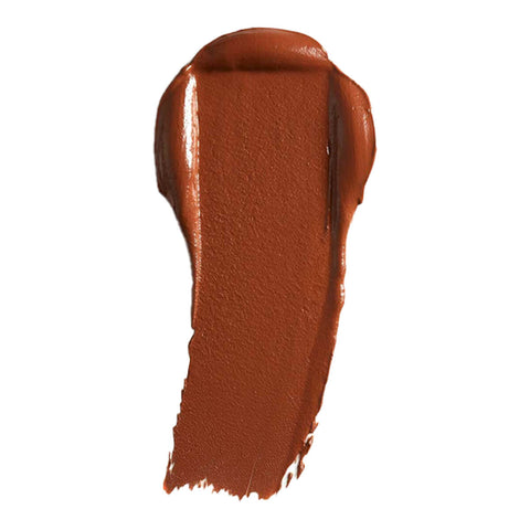 Swatch of cream foundation in the shade 'Velvet', a deep shade with cool undertones.