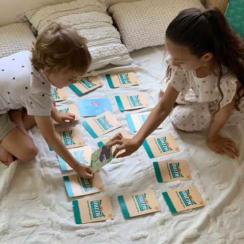 Kids playing with Mizzie The Kangaro Mizzie Memory Match 4-in-1 Flash Card Game Set, a 3-level game set includes 36 cards and 18 pairs, providing a fun and interactive way to exercise their growing brain.