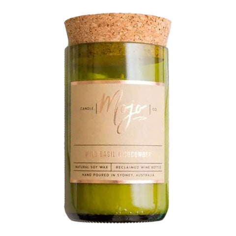 Mojo Candle Co. wild basil and cucumber scented candle, hand-poured into a reclaimed wine bottle with natural soy wax.