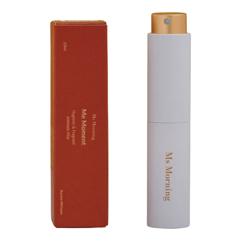 10ml tube of Ms Morning Me Moment Hygienic & Fragrant Intimate Mist, a discreet, travel-friendly mist formulated for delicate needs, ensuring you stay fresh and protected, next to its red box. Packaged in a glass tube with a gold lid.