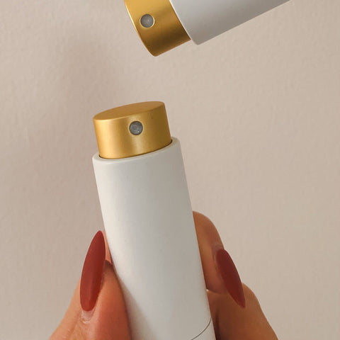 Close up of 10ml tube of Ms Morning Me Moment Hygienic & Fragrant Intimate Mist, a discreet, travel-friendly mist formulated for delicate needs, ensuring you stay fresh and protected. Packaged in a glass tube with a gold lid.