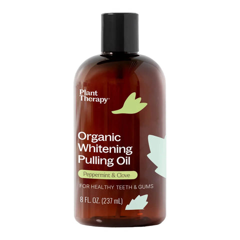 Small bottle of organic whitening pulling oil with peppermint and clove.