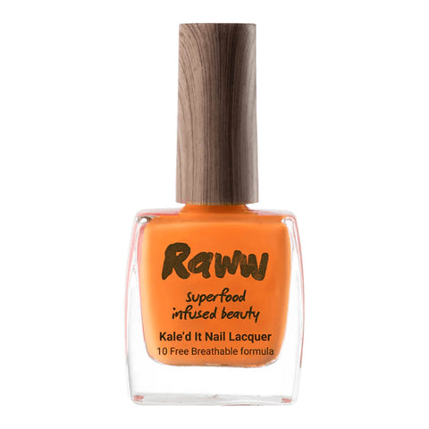 Bottle of non-toxic, bright orange nail polish with kale protein infusion.