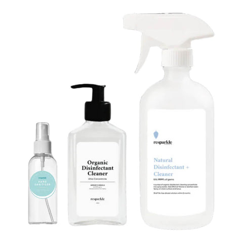 Cleaning kit with a reusable hand sanitiser bottle, spray bottle, and organic disinfectant cleaner concentrate.