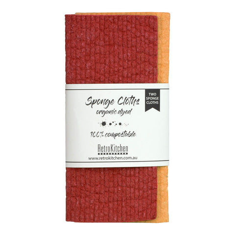 RetroKitchen Organic Dyed Compostable Sponge Cloth Set, a set of 2 super absorbent, machine washable and compostable dish cloths made from cotton and cellulose. Comes with a dark red and orange cloth. Packaged with a paper tag.