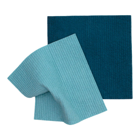 Light and dark blue organic dyed compostable sponge cloths.