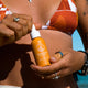 Person holding dropper bottle of nourishing face oil with boab, wattle and kelp.