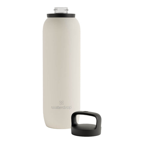 1L waterdrop All-Purpose Steel Bottle, a double walled, vacuum insulated, stainless steel water bottle with a matte cream body and a black lid. The lid is screwed off the bottle.